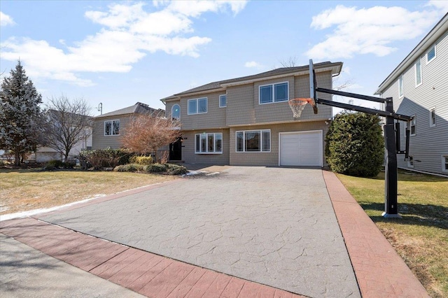 view of front of house with driveway, a garage, and a front lawn