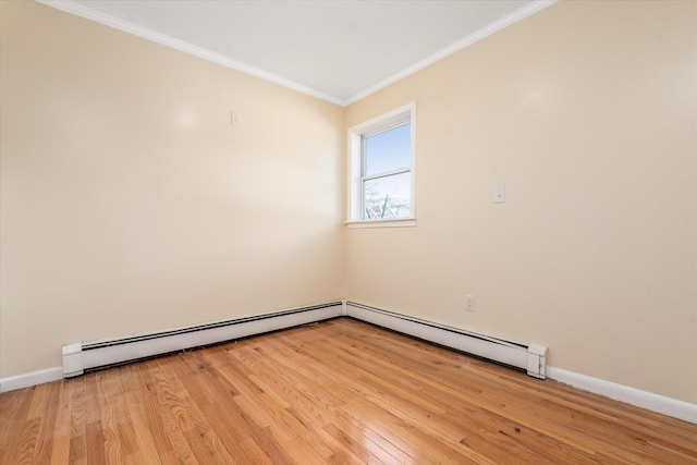 empty room with light wood-type flooring, crown molding, baseboards, and a baseboard radiator