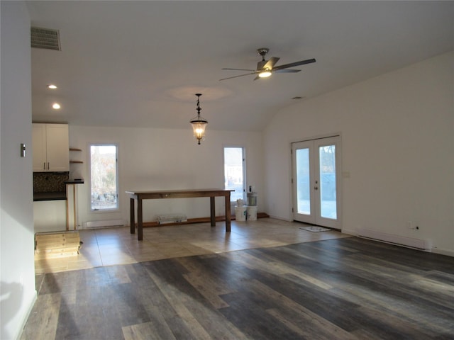 interior space featuring french doors, recessed lighting, visible vents, vaulted ceiling, and wood finished floors