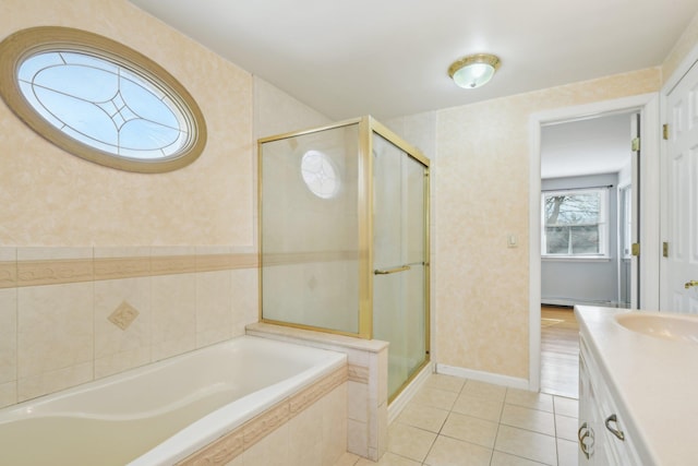 bathroom with a garden tub, a stall shower, vanity, tile patterned flooring, and wallpapered walls