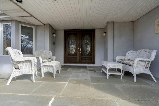 doorway to property with covered porch