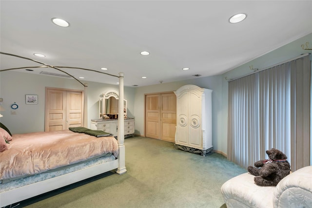 bedroom with recessed lighting, light carpet, and baseboards