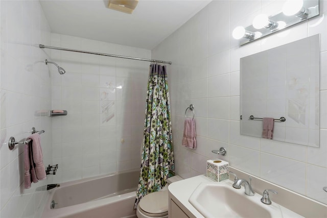 bathroom featuring tile walls, backsplash, toilet, shower / bath combo with shower curtain, and vanity