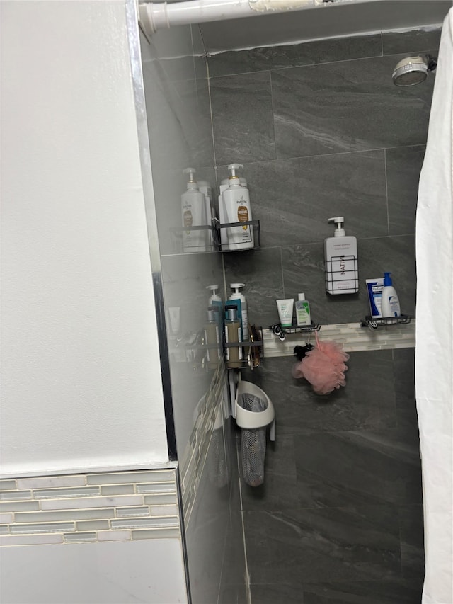 bathroom with tiled shower