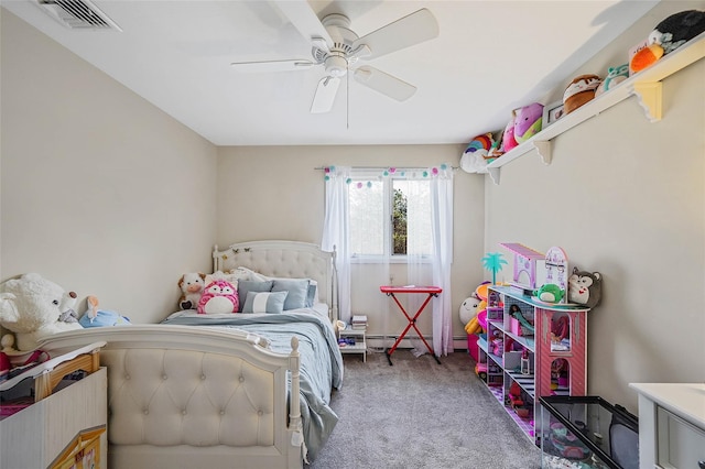 carpeted bedroom with a baseboard heating unit, visible vents, and a ceiling fan