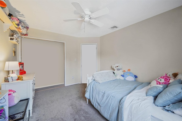 carpeted bedroom with visible vents, ceiling fan, and baseboards