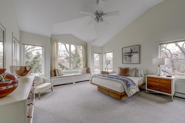 bedroom with lofted ceiling, multiple windows, and carpet flooring