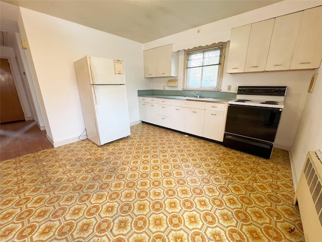 kitchen with lofted ceiling, freestanding refrigerator, light floors, electric range oven, and baseboards