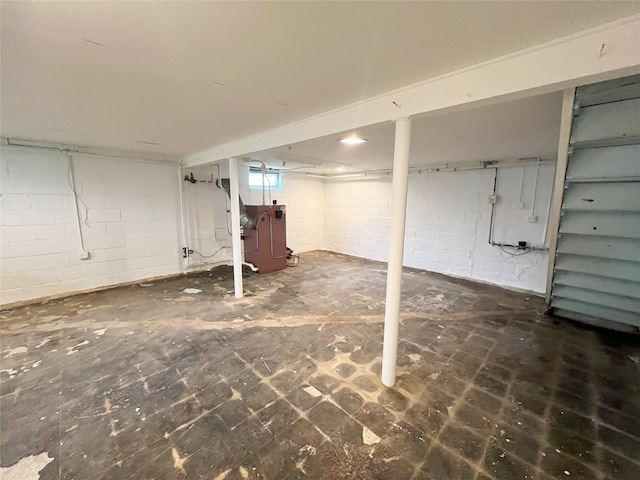 basement featuring concrete block wall
