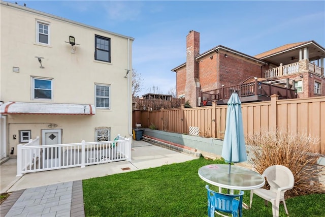 view of yard with a patio area and a fenced backyard