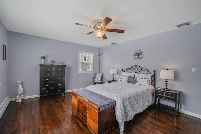 bedroom featuring dark wood finished floors, visible vents, and baseboards