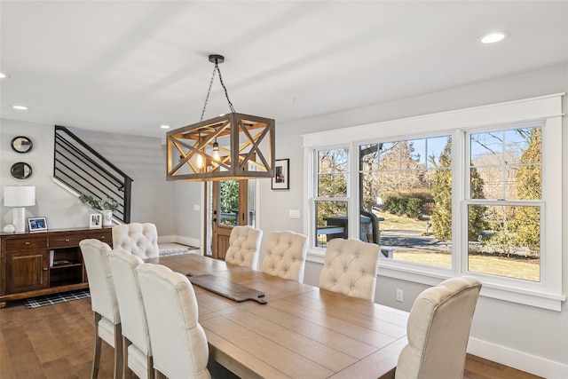 dining room with dark wood-style floors, stairs, baseboards, and recessed lighting