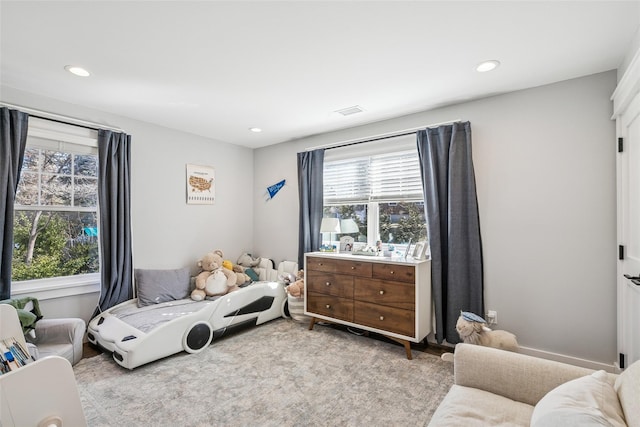 bedroom with visible vents and recessed lighting