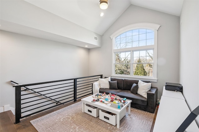 living area featuring visible vents, high vaulted ceiling, wood finished floors, and recessed lighting