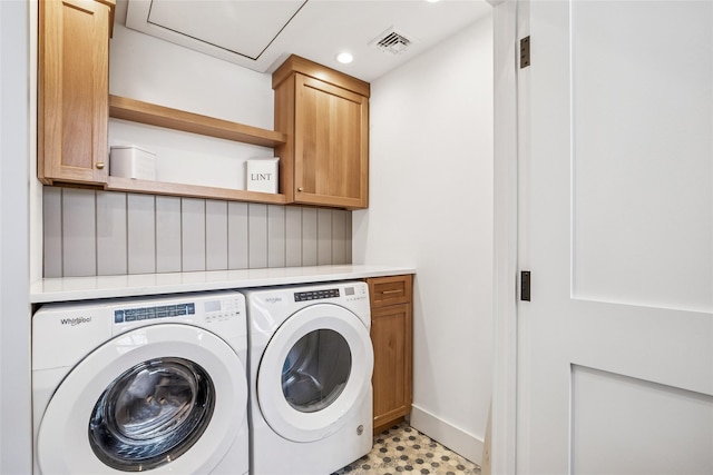 laundry area with light floors, cabinet space, visible vents, washing machine and dryer, and baseboards