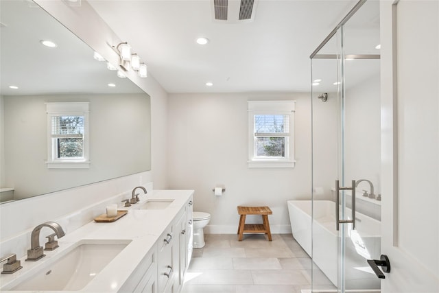 full bath featuring toilet, a sink, visible vents, and a shower stall