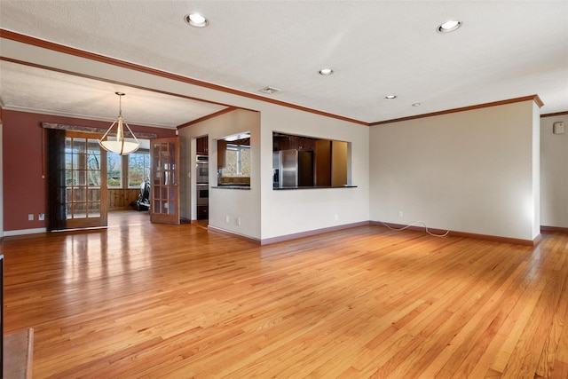 unfurnished living room with light wood-type flooring, recessed lighting, baseboards, and ornamental molding