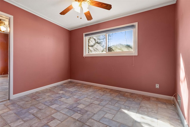 unfurnished room with a ceiling fan, stone finish flooring, baseboards, and crown molding