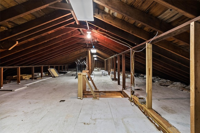 attic featuring an upstairs landing