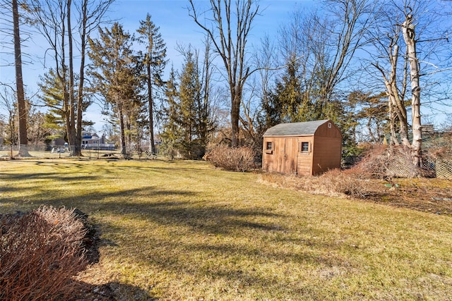 view of yard with an outbuilding and a shed