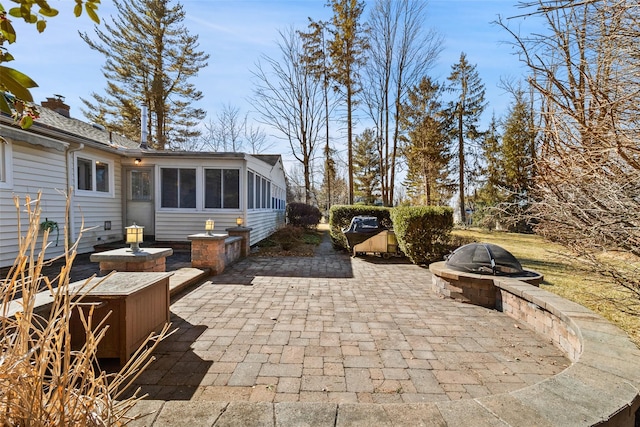 view of patio / terrace featuring an outdoor fire pit