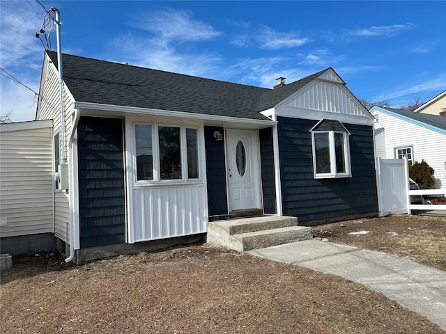 view of front of property featuring a shingled roof and board and batten siding