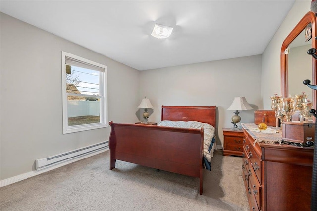 bedroom with baseboards, baseboard heating, and light colored carpet