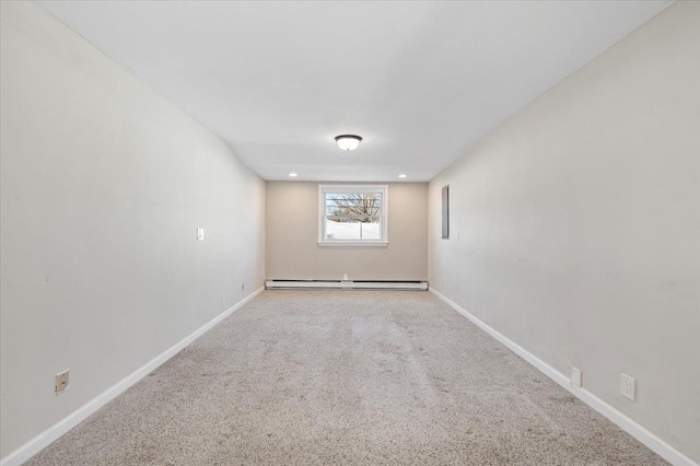 empty room featuring baseboards, a baseboard heating unit, carpet flooring, and recessed lighting