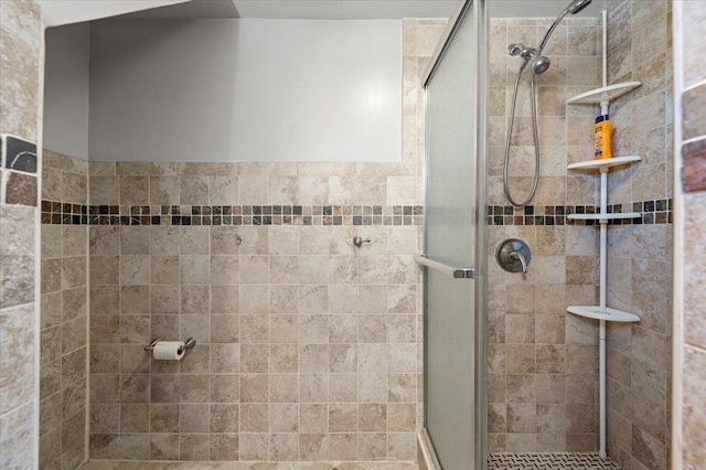 bathroom with a shower stall