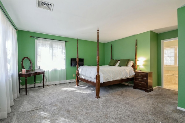 carpeted bedroom featuring a baseboard radiator, visible vents, and baseboards