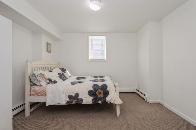 carpeted bedroom with a baseboard radiator and baseboards