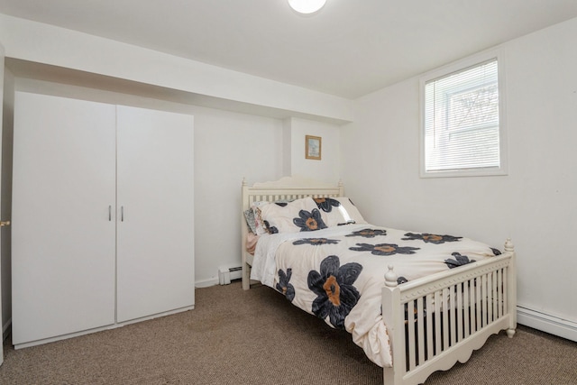 carpeted bedroom featuring a baseboard radiator