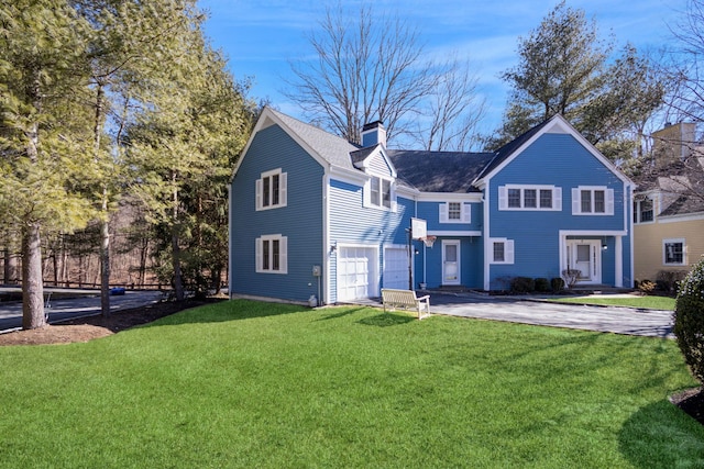 view of front of house with a chimney, a shingled roof, an attached garage, driveway, and a front lawn