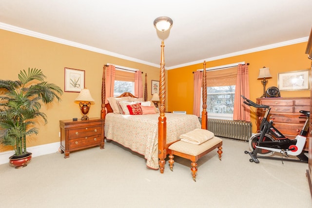 carpeted bedroom with radiator, baseboards, and crown molding