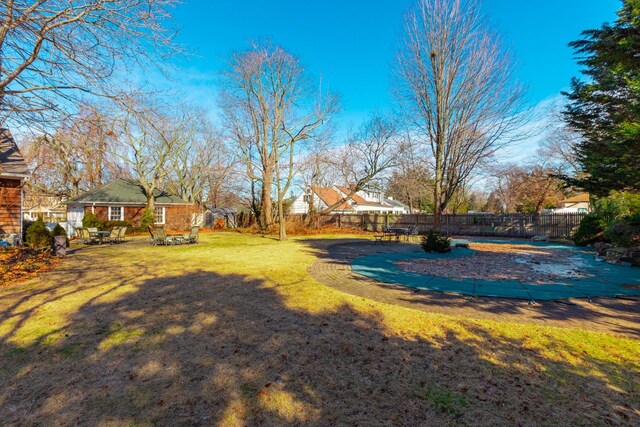 view of yard featuring a patio and a fenced backyard