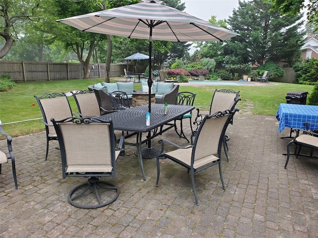 view of patio featuring outdoor dining space and a fenced backyard