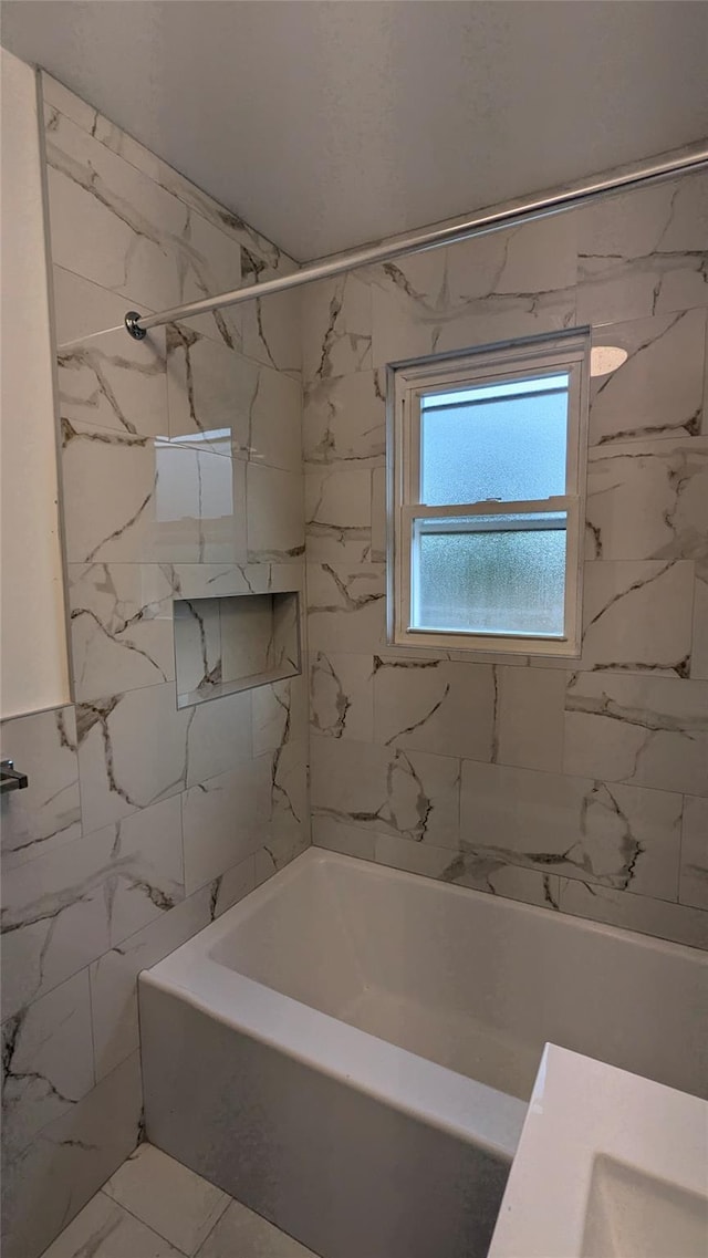 full bathroom featuring tile walls and bathing tub / shower combination