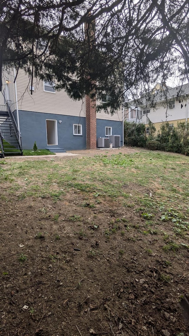 view of yard featuring stairway