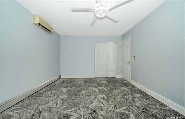 unfurnished bedroom with a baseboard heating unit, a closet, a wall mounted air conditioner, and baseboards