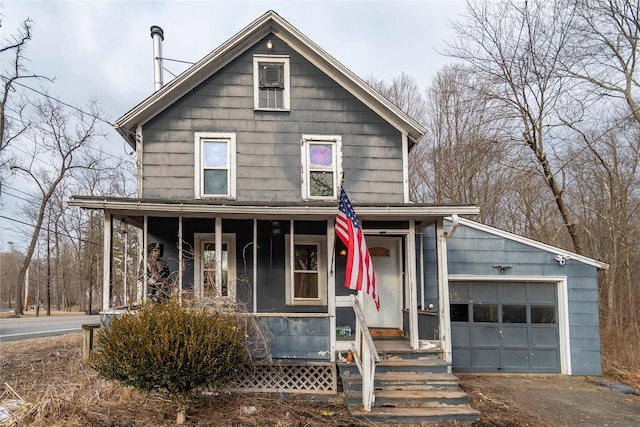 view of front facade with covered porch and an attached garage