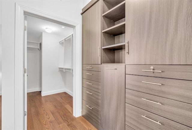 spacious closet featuring light wood-type flooring