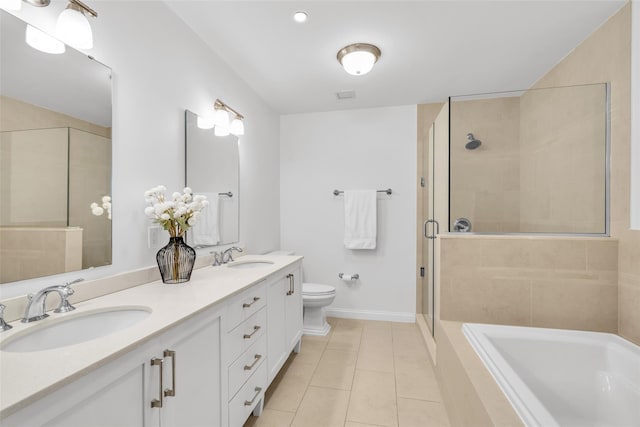 full bath with toilet, a shower stall, a sink, and tile patterned floors