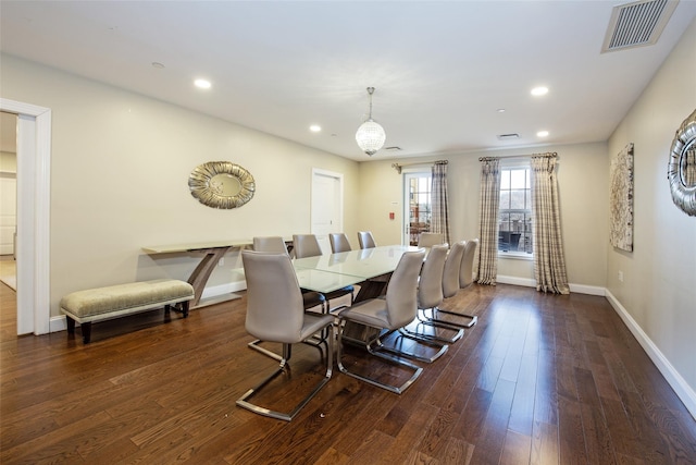 dining area featuring baseboards, visible vents, dark wood-style flooring, and recessed lighting