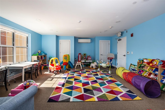 playroom with carpet floors and an AC wall unit