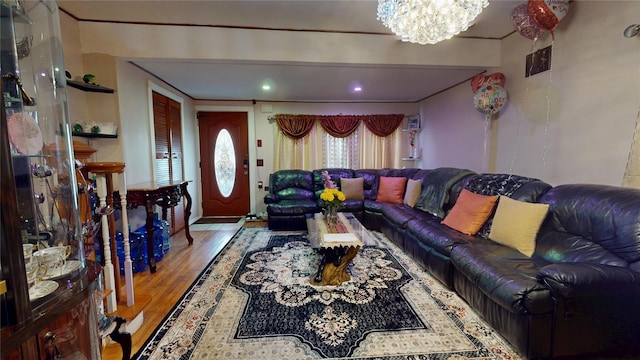 living area with light wood-type flooring and a notable chandelier