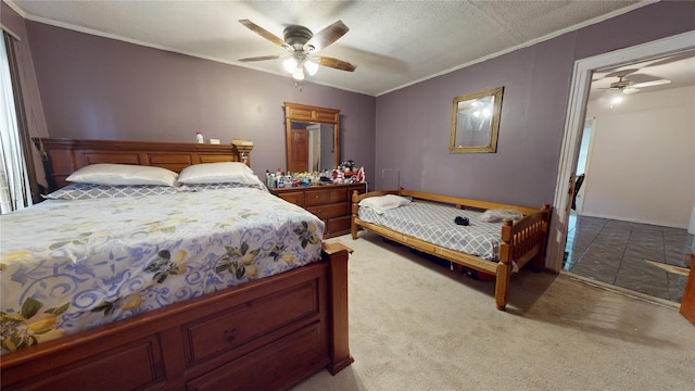 bedroom with a ceiling fan, light colored carpet, crown molding, and a textured ceiling