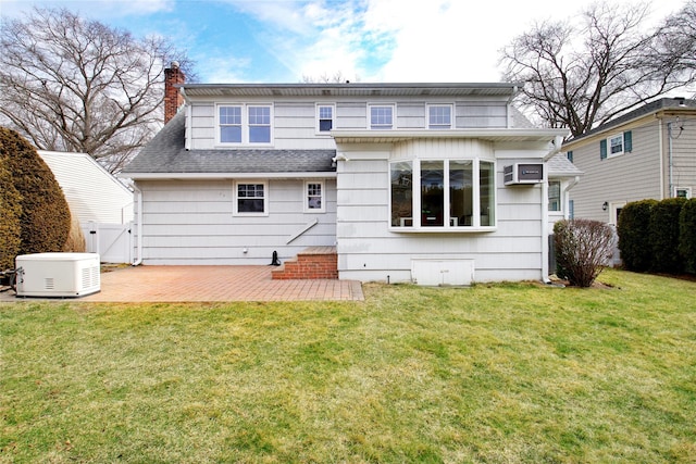 back of property featuring a patio, a lawn, and fence