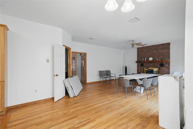 97 Ludlam Rd, Monroe, NY 10950 - living area featuring light wood finished floors, a ceiling fan, baseboards, and a brick fireplace