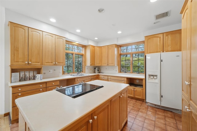 97 Ludlam Rd, Monroe, NY 10950 - kitchen with white fridge with ice dispenser, plenty of natural light, a sink, a kitchen island, and recessed lighting
