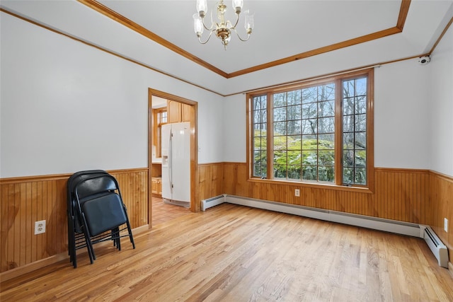 97 Ludlam Rd, Monroe, NY 10950 - unfurnished room featuring a chandelier, wainscoting, wood finished floors, baseboard heating, and ornamental molding